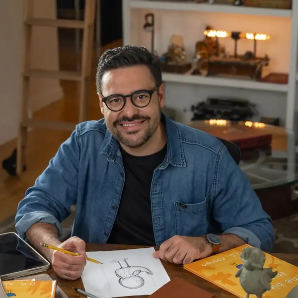 D.G. Alonso, author and illustrator, at his drawing desk sketching Finch